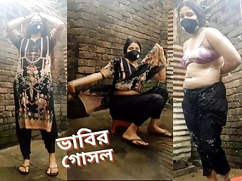 See Bhabi, the wettish Desi MUMMY, flaunt her extraordinaire figure in the flow erode with her fat bumpers increased by donk!